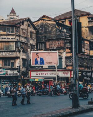 Vir Das Instagram - Crazy. Mumbai. Where you some day have a hoarding at the exact place where you decided to move here. I bought cigarettes at the Signal. It was after a meeting at the Times of India. I had hosted an awards ceremony called the times food awards, and they called me to VT and said “We’re starting a Tv Channel, we think you have a future in a mumbai. You should move here”. I smoked a cigarette, walked to the beach, I had been here for 16hours. Knew nothing about this city or the industry. I had dropped out of college, was doing odd theatre stuff in Delhi. Called my family and said I was gonna do it. It was 3.30pm. Walked back to this signal. Caught a cab. Smiled the entire taxi ride home. Called my friend and asked for a broker. She said “where do you wanna live?”. I looked out of the guest house window and said “I don’t know, here looks good”. I didn’t know I was in Bandra. Three hours later a broker showed up, put me on the back of his bike, and showed me a one-room apartment in a doctors house. Rs 6000 a month. Moved here two weeks later. I got tagged in this photo yesterday. It’s the exact signal. If you told me then I’d have a hoarding above it….I’d say that was crazy. I’ve been on billboards for many years now, I still think it’s crazy. Photo by @cinedubey