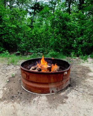Yaani King Mondschein Instagram - This is camping. 🪷🌿⛈️🔥☀️🏕️
My very first time ever.
.
.
1. Feet up before going camping
2. Our first fire of the trip brought to you by @amondschein 
3. Adam making us a quick snack with said fire 
4. Our home for 5 days
5. The pond at sunset by our site😌
6. The pond was nearly covered with these! 
7. Colorful fire magic 😉
8. New best friend 🐢
9. Rocks found on our walk to the end of the world 
10. What felt like the end of the world. The tide was so far out! 
.
Thank you @emhatami and @kamalhatami for sharing your anniversary with us! We had the best family time! And thank you Cape Cod for showing us who you really are.😜#HotWetAmericanSummer #ThatsWhatSheSaid