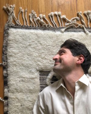 Yuriy Sardarov Instagram - So I turn 33 tomorrow (Aquarius szn!) and to celebrate, Madi and I got this masterpiece from Bazar Du Sud.

Made from 100% sheep’s wool in Marrakech, she’s the special kind of fluffy friend that’ll make you swear off red wine for the rest of your life.

In the market for a rug? Give @bazardusud a follow, ask for Yazid, and tell em yursar sent you.
