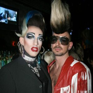 Acid Betty Instagram - I met a guy at every @misssherryvine show who quickly became one of my dearest and best friends. I'll never forget the day I saw his faux hawk, and I thought to myself, 'I want to wear that and dress up with you next week.' That moment marked the beginning of what is now known as Acid Betty (there’s a photo him putting me in his first hawk piece, I was LIVING!).

Marec was not only my personal hairdresser but also my closest friend and the ultimate party companion. He taught me everything I know about hair and is the creator of my signature mohawk and wiglets, as I fondly call them.

Getting older has its challenges, but perhaps the toughest part is losing the friends and companions who have been with us through the years. I used to take photos like crazy before cameras were part of our phones (haha), and I've dug up some early snapshots of us. Those were the days when we'd experiment with hair and makeup and parade around the clubs like a couple of wild fools!

Marec, I miss you more than words can express. You will always be in my heart, and I'll forever cherish the memories we created together. I love you, Acid Sharek!