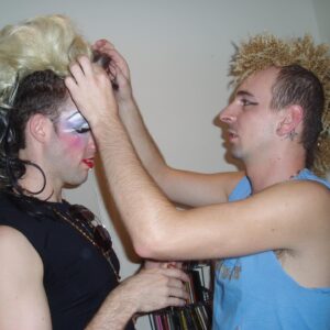 Acid Betty Instagram - I met a guy at every @misssherryvine show who quickly became one of my dearest and best friends. I'll never forget the day I saw his faux hawk, and I thought to myself, 'I want to wear that and dress up with you next week.' That moment marked the beginning of what is now known as Acid Betty (there’s a photo him putting me in his first hawk piece, I was LIVING!).

Marec was not only my personal hairdresser but also my closest friend and the ultimate party companion. He taught me everything I know about hair and is the creator of my signature mohawk and wiglets, as I fondly call them.

Getting older has its challenges, but perhaps the toughest part is losing the friends and companions who have been with us through the years. I used to take photos like crazy before cameras were part of our phones (haha), and I've dug up some early snapshots of us. Those were the days when we'd experiment with hair and makeup and parade around the clubs like a couple of wild fools!

Marec, I miss you more than words can express. You will always be in my heart, and I'll forever cherish the memories we created together. I love you, Acid Sharek!
