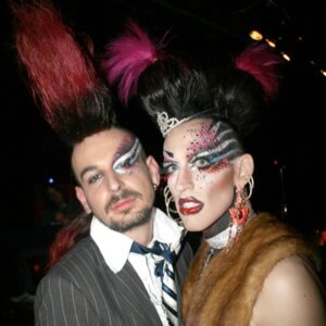Acid Betty Instagram - I met a guy at every @misssherryvine show who quickly became one of my dearest and best friends. I'll never forget the day I saw his faux hawk, and I thought to myself, 'I want to wear that and dress up with you next week.' That moment marked the beginning of what is now known as Acid Betty (there’s a photo him putting me in his first hawk piece, I was LIVING!).

Marec was not only my personal hairdresser but also my closest friend and the ultimate party companion. He taught me everything I know about hair and is the creator of my signature mohawk and wiglets, as I fondly call them.

Getting older has its challenges, but perhaps the toughest part is losing the friends and companions who have been with us through the years. I used to take photos like crazy before cameras were part of our phones (haha), and I've dug up some early snapshots of us. Those were the days when we'd experiment with hair and makeup and parade around the clubs like a couple of wild fools!

Marec, I miss you more than words can express. You will always be in my heart, and I'll forever cherish the memories we created together. I love you, Acid Sharek!
