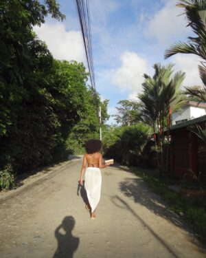 Ajani Russell Instagram - Bliss is truly just eating a coconut you opened with only your hands under a waterfall.

I went on a very special retreat with @theintuitionschool.co last month. I attended as a cohost and a teacher but I learned so much on this trip I might as well have been a student. So many lessons and experience that will never  be articulated because the land doesn’t speak english. This particular day at the waterfall I released something that no longer served me, I saw many lil frogs and I learned how to crack open a coconut on a rock (El saw me do this and said ‘damn you’re carribean af’ 😂) I reconnected with myself and my roots in ways I didn’t know I wanted but definitely needed. The first of many Costa Rica photo dumps. Can’t wait to share the rest with y’all. 🫶🏾