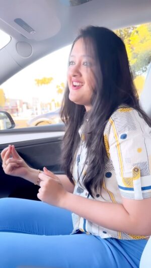 Akhila Pajimannu Instagram - It was Sunday.Our Tesla was charging for a while.Jai and me were chilling.I started singing.Suddenly Jai started doing video out of no reason..Hmm..Why you started doing video @trdhananjai_sharma ❤️ ? 
Thought of covering this properly and the video came out like this!!
Ani @aneesh_pajimannu you are the one who wanted me to sing this song right!!Here you go!!

#akhilapajimannu #singer #song #tamil #movie #music #random #chill #sunday #weekend #tesla #causal #ootd #instagood #instadaily #réel #reelsinstagram #reelsvideo #reelitfeelit