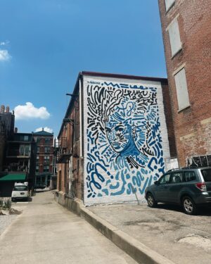 Akilah Hughes Instagram - Went back to Kentucky (the Greater Cincinnati area) to celebrate Juneteenth, pressure my school to change their racist mascot, and enjoy the 100° heat around downtown Cincinnati. It was a wonderful trip. 🩵🌈 If you still haven’t, go check out the podcast trailer for Rebel Spirit, link in bio. It’ll give you a better sense of what I’m doing and why.  Did you know Rebel Without a Cause (1955) is lauded as being the first Hollywood film to depict gay teens