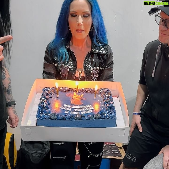 Alissa White-Gluz - 41K Likes - They got me! 🤣
On May 22nd we had the pleasure of being all together to celebrate Daniel’s birthday - but that’s not all. The drumset dream team includes @kuschdrums - our beloved DJ Oatmeal and drum tech extraordinaire, and believe it or not, May 22nd is Kusch’s birthday too!
I am not a big fan of getting surprised but I LOVE surprising other people. So we set our sneaky plans in place to surprise Daniel and Kusch with a birthday party before the show in Jakarta.
Much to MY surprise (a good one for once), when we flipped open the birthday cake box, inside was also a big, blue, vegan, anniversary cake for me! Can you believe it was exactly 10 years to the date since my first show with @archenemyofficial in Bucharest?! 🤯
Thank you so much to my band and crew brothers for remembering this special occasion and for showing me that surprises can be good 💙 I’m so happy I got to commemorate such a milestone with (almost) the whole family present! It really meant a lot to me! Thank you Michael, Daniel, Francois, Kusch, Paavo, Diac, Joey, Sharlee, Patty, Martin as well as the local crew (and the four missing blondes!) for making my first time Indonesia (a place I have wanted to visit for years) truly special! 💙