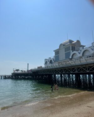 Amanda Lamb Instagram - Just the best day in the Motherland with my gorgeous Dad and my beautiful sister and the extended brood.. arcade, candy floss, Southsea pier and a swim in the sea until we all legged it when we saw a jellyfish.. behind my shoulder in the last picture used to be a night club called 5th Avenue where I had my first snog with a boy called Rob Linnell during the erection section at the end of the evening when all the slow dances came on.. Simply Red’s Holding back the Years… I wonder where he is now? Rob that is not Hucknall, he’s probably in St Tropez or the likes… who and where was your first kiss?