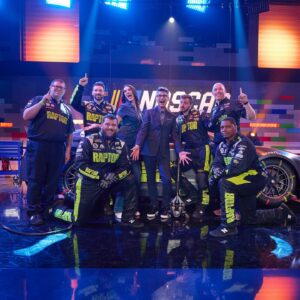 Amy Corbett Instagram - It’s almost the weekend, so let’s go behind the scenes of one of my fave episodes…Nascar! 🏎️🏁🏆
Such a fun one to make. Check out my LEGO Dots patches, designs customised to be totally on theme. And the awesome pit crew that showed us how to change a tyre in record speed!!! I was definitely not a natural, so I’ll leave it to the experts. What a great bunch! 
.
.
.
#legomasters #legomastersfox #legomastersusa #behindthescenes #behindthescenes🎬 #bts #lego #nascar #weekendvibes