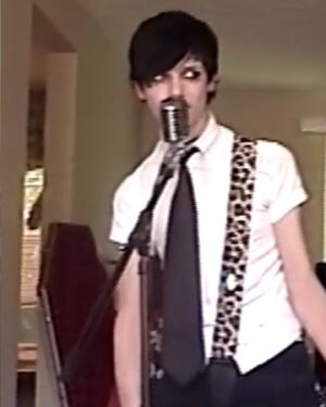 Andy Biersack Instagram - Thinking a lot today about the impact that music has on a person’s life. I saw a quote from the actor Ethan Hawke talking about how vital art is to the human experience and it struck me how without the songs and words of my heroes I would likely be an entirely different person. When I was 12/13 and listening to @alkaline_trio the words of Matt and Dan felt like religious text. They were the scriptures by which I built myself up and found confidence in who I was. Spending hours upon hours singing those songs and putting on pretend rock shows in my room wishing to be like them and to connect with other people the way they connected with me. There are countless bands and artists like AFI, Social Distortion, Bruce Springsteen, The Misfits etc. that inspired me endlessly but without discovering Alkaline Trio I’m not sure I would be who I am today. Here’s a bunch of photos of me as a pre teen pretending to be Matt Skiba in my childhood bedroom (plus a video from getting to watch them play at when we were young fest a few years ago) and starting to work on the dream. This summer we get to play our songs as part of a tour in giant venues across the US and then in October we get to co-headline Wembley Arena in London. Pretty cool shit and I want to say thanks for that 🖤