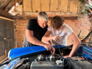 Ant Anstead Instagram - When I was 17 my first car was an MG Midget (called Bridget). I loved that car, saved up working part time jobs washing pots and waiting tables to buy her. I learned so much repairing her and keeping her on the road! Bridget the midget was the foundation that set me on a path to be a car builder! 

Today was an emotional one as @archoanstead joined me onset of my new show Naked Mechanic and at 17 he and I worked together on the exact same car, but blue (my Bridget was orange). It was a moving day and Archo was a natural!!! 

Cannot wait to share this moment. I hope more people tackle parent-child car projects together…. Proud of you Archo!!! X x 

Naked Mechanic coming soon to Discovery Channel x