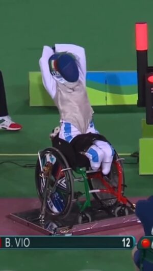 Bebe Vio Instagram - Laughing through the pain! 🤺

@bebe_vio gets stung on the head by a loose fencing shot. Vio is then aided by a team assistant who applies an ice pack, while making Bebe laugh. 

Accessible description: Wheelchair fencing match in play. Vio is stung by the weapon and a team assistant helps her with an ice pack. 

#WheelchairFencing #Fencing #Paralympics