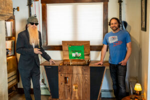 Billy Gibbons Instagram - Got to do my Vanna White impression on a visit to the home of Streamline HiFi.  Digging the vinyl line up above as well as these sensational stereo consoles.  The big one on the left is called The Mojo and the one playing Rio Grande Mud is The Crossroads. “Francine” approved!  More “blues you can use” at streamlinehifi.com (link in bio)