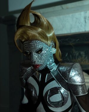 Black Peppa Instagram - “And when you become a diamond, you’ll understand why life had to put pressure on you.” 

My first post for 2023! Saying that 2022 was an amazing year would be an understatement. Not only was it life-changing, but also filled with growth and maturity in my queer journey. After the Drag Race finale, I took it upon myself to place my mental health in the forefront and to do so I had to make some tough decisions before entering 2023.

Unfortunately I’ve always been a people pleaser and this got in the way of me truly living. I’d say it’s the way I was raised. It was truly hard for me to watch the show back episode after episode because although I was fully being myself, I saw that young Caribbean boy fighting his inner demons; insecurity, shame, timidity, and self doubt. 

I’ve had to pull away from some circles, friends, family; all just to really focus on me and understand the way my brain is wired. Daily walks that lasted for hours on end, hiking in my local park and yelling to the top of my lungs, meditation that led to non stop crying and reconnecting with Akeem. 

Most people will never understand but to find balance in a busy life is seriously the most important thing one can do for themselves.
Ever since prioritising myself, the veil has been lifted off. My past trauma had me as the punching bag and it was time to face it head on. Anything that scares you, will change you …and trust me pain will change you. 

I feel an illuminating switch happen in my spirit and finally feel sweet release. It’s a feeling that I can in the best way describe as growth and purpose! I am ready to take on the world while doing what I love. MY happiness, MY joy, and MY well-being will always come first no matter what. Life will not throw at you what you can’t handle, trust the process 💎 ✨

Decided to redo this shoot I did with the fully rhinestone face in 2019 inspired by Jenna marbles. Thanks @dojacat & @patmcgrathreal for reigniting my creativity with the show-stopping red @schiaparelli look! 

Photographer: @ivantruewizard 
Retouching: @jordanwindows & @manuconejer0 
Space-age catsuit: @simonpreen 
Wig: @styledbyvodka 
Rhinestone heels: @joeyalantaylor & @trashyplanets