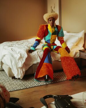 Black Peppa Instagram - BTS shots before heading to @frolovheart SHOW. Thank you @thelondoner 💖

LFW- LOOK 4- Wearing custom @christopherniari to attend the @frolovheart SHOW. Had this concepts for months where I’d use various fabrics with different textures particularly bathroom rugs, felt, suede, faux leathers and furs to create a groovy tailored high waisted pants suit. For this LFW it was also my priority to showcase more black hair styles and desired to style a blonde Afro myself. This was the first time I’ve styled any wig and was quite proud of the end result I must say.

Photographer: @kimlangstudio 
MUA: @jackoliverx using @theunseenbeauty 
Full look: @christopherniari 
Hair by me
Earrings: @nobasicbombshell
Money Nails by @nailsanthonys