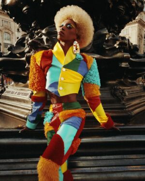 Black Peppa Instagram - “Won’t you take me to Funkytown?”

LFW- LOOK 4- Wearing custom @christopherniari to attend the @frolovheart SHOW. Had this concepts for months where I’d use various fabrics with different textures particularly bathroom rugs, felt, suede, faux leathers and furs to create a groovy tailored high waisted pants suit. For this LFW it was also my priority to showcase more black hair styles and desired to style a blonde Afro myself. This was the first time I’ve styled any wig and was quite proud of the end result I must say.

Photographer: @kimlangstudio 
MUA: @jackoliverx using @theunseenbeauty 
Full look: @christopherniari 
Hair by me
Earrings: @nobasicbombshell
Money Nails by @nailsanthonys