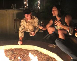 Blair Redford Instagram - Two men giggling over some campfire gossip with red wine and marshmallows.