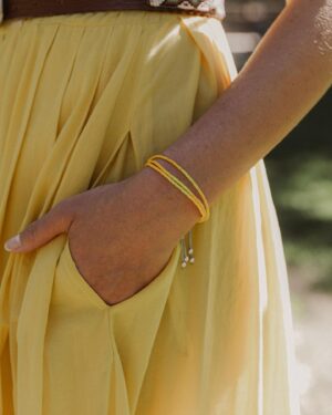 Caitlin McHugh Instagram - Excited to share a new bracelet from our BeCAUSE We Care collection with @mysaintmyhero !! Proceeds of this little yellow bracelet benefit @ifhomeless a wonderful organization working hard to disrupt homelessness.  Thanks to my Sister-in-Law @alainastamos I’ve had the opportunity to see firsthand the incredible work they do to improve the lives of the people they serve.