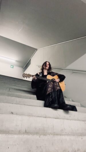 Chelsea Wolfe Instagram - playing “Flatlands” in a stairwell behind the stage at @primavera_sound Barcelona. the full version is up on my YouTube channel. 
⬅️
