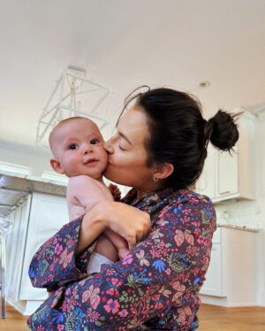 Chloe Bridges Instagram - Six months postpartum today 🤯🥹 Beau and I have giggled, cried, cuddled, had most of our hair fall out (y’all didn’t warn me about that one), grown, become better nappers, and learned a whole lot. He’s 2.5 weeks in the first slide and 5.5 months in the last… what do they say? The days are long but the years are short? I’m currently typing this as he is latched on my boob and I am still in last night’s pajamas (it’s 5:47 pm) so yeah that checks out lol