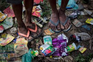 Chris Packham Instagram - Orang Rimba camp , Sumatra . Canon 5D SR , 11-24mm F4 . When I asked why these camps were carpeted with plastic I was told that the tribe was used to eating food from leaf ‘plates’ which when empty would be dropped onto the jungle floor to decompose . They have yet to adjust to plastic which they drop and doesn’t decompose . The switch from remote hunter-gathering to settlement on the edge of villages is too much in less than a generation . ‘Chris Packham : In Search of the Lost Girl’ BBC2 , 9pm , Sunday . #sumatra #palmoil #palmoilfree #photography #photooftheday #portraitphotography #canon #canonphotography #canonuk
