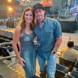 Danielle Busby Instagram - What a way to end our no date night streak 🤪 Tonight with my Buzz 🤍 and great music, I could sit here all night! 
@lukecombs !! Amazing ! Best part of the performance is hearing the heart in your stories about your music and also hearing the joy and passion you have for your music. GREAT JOB!
(Oh! And my Jean dress is snatch #justsaying #steph 😂)