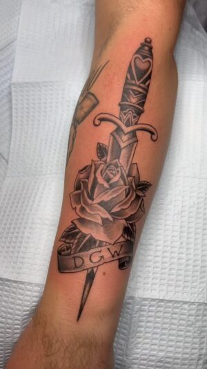 Darren Brass Instagram - I’ll never get tired of a Dagger & Rose tattoo🗡️🌹 @brasscitytattoo … #tattooartist #tattoo #tattoos #tattooart #ink #inked #tattooed #art #tattoolife #tattooideas #tattooist #tattoodesign #tattooing #artist #tattooer #tattoostyle #blackandgreytattoo #blackwork #tattoostudio #tattooshop #instatattoo #tatuaje #tattooflash #tatuajes #tattoolove #brassandgrey #tatuagem #traditionaltattoo #thepearl