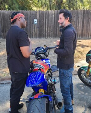 Derek Luke Instagram - chilling in front of #keanureeves amazing (#ARCH custom bike) got to get me one:) always Great to run into another bike enthusiast, chopping it up [getting advice] on the new #BikerBoyz reboot, LETS GO BURN RUBER ONLY-NEVER YOUR SOUL