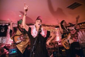 E. R. Fightmaster Instagram - This year my band FIGHTMASTER threw a holiday show in support of Alexandria House. Thank you to our incredible guests @carolinerosemuzak @goldsoundz_ @brideymusic and @alexisgfloyd for bringing the house down, and for our incredible audience for bringing the joy. May your holidays be gay and your New Year even gayer. 
Special thanks to Morgan if Ye Merry Merch Table, to @taliahart always, to @permanentrecordsroadhouse for housing us and to @dubinphoto for capturing the moment ❤️ @alexandriahousela ❤️