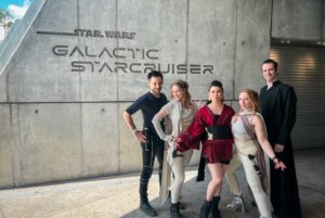 Erika Ishii Instagram - May the 4th be with you! Last year, my crew and I booked passage on the Star Cruiser Halcyon. It was a transcendent immersive experience and immensely inspired me in my storytelling. Thank you @car0mur for introducing us to the colorful characters onboard, and to the cast and crew who made our stay unforgettable. My friends and I boarded with elaborate backstories and costumes and every person aboard met us at our level and helped us live out our dreams on a galaxy far, far away. ♥️

Meet the motley crew of the Arabesque, a humble merchant ship that can help acquire anything you need.  Our pilot always said, “She doesn’t look like much, but out there in the stars, she dances.” I was Captain Lane Vizla (I borrowed the name of the SWTOR character I voice!) Socialite and pulp holo-vid actor by day, and by night a scoundrel using social connections to aid the Resistance. I hand painted my gown with Aurabesh: JUSTICE, TRUTH, LOVE.

Also today I can announce another new credit in a Star War: I’m a friendly Scoundrel/Smuggler in LEGO Fortnite!