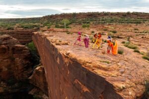 Ginny Lemon Instagram - “A cock, in a frock, on a rock, IN CROCS!”

In honour of the 30th anniversary of The Adventures of Priscilla, Queen of the Desert me and my sisters @officialsistersister @queenutica and @joeyjayisgay were given the fantastic opportunity to re-enact the final scene by claiming up Kings Canyon in full drag to commemorate 30th years of this iconic Australian drag masterpiece of cinema, a cult classic and any drag queens favourite. 

I could never in my wildest dreams believe that I would be lucky enough to be chosen for this, proper have to pinch myself. 

Also when they said “hey do you wanna do a photoshoot up Kings Canyon” I never thought about ACTUALLY walking up there, in FULL DRAG at 4am in the DARK! But we did it! To watch the sunrise in one of the most beautiful places on earth, was an absolute honour. 

Big love and shoutout to the amazing team who were with us the whole way and put up with my Diva fits @thekassieh @with.all.drew.respect  and @discoveryparksandresorts

Shot by @kanechenoweth on location at @watarrkanationalpark 🏜️

#ntaustralia @ntaustralia

Travel #sponsored by @australia 

#SeeAustralia