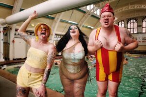 Ginny Lemon Instagram - Big Fatt Pool Party! @fattprojects 

I cannot explain to you how much I loved this event! Seeing so many diverse bodies in a pool was like a blissful fever dream. 

I don’t know about you but historically for me places like gyms, pools, anything remotely related to sport have also been associated with hate crime and insecurities. But THIS event was a game changer. I felt free, happy, fabulous & safe. 

Also leading an “aqua aerobics” session was a dream come true… watch this space… the mass YMCA is always a bonus 🤣

I truly hope we get to do more! Thanks @moseleyrdbaths for having us. 

@fattbutcher @mama.mamba @just_soriah what a dream team 😍

📸 @irinamackie