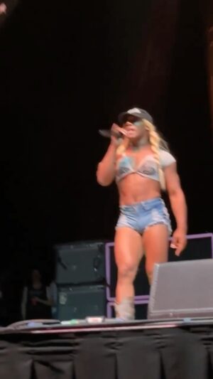 Hassan Aziz Instagram - In my #numetalcowgirl era. 🤘😝 #Bizkette since day 1 💋 @freddurst 

#limpbizkitstyle #redcapgirl 🔥

🎥: @danitalkswrestling 💜