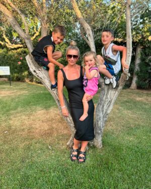 Helen Skelton Instagram - When the year old doesn’t get a shot at her own pram….. 
and the cute outfits I got for them are overlooked for a bargain bulk buy of last years Menorca merch…..
Just over here picking my battles.❤️😍🤪
#memories #summer #holidays