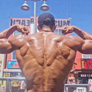 Ike Catcher Instagram - We Back like that! #biggestmanonthebars #back 
Spreading my lats like they are wings Sit in the sun  like im the sphinx #ikeCATcher #kingofmusclebeach