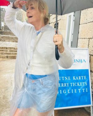 Jane Moore Instagram - My friends kindly invited me to Croatia for a short break and some sunshine. Except the weather didn’t get that memo. It rained biblically for the first three days, forcing me to purchase this rather fetching pac-a-mac for my day trip on the ferry to Dubrovnik which, as you can see if you swipe left, was experiencing an unprecedented downpour. But luckily, the sun put its hat on for my last day before heading to the airport to discover the BA flight was delayed and we didn’t eventually land until 2am 💃But it was still great fun and thankfully my teeth (which appear to be missing in photo one) have now grown back. Hope you’ve all been enjoying the UK heatwave whilst I’ve been away 😂 #dubrovnik #croatia #lopud