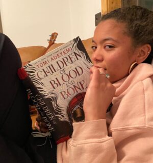 Jaz Sinclair Instagram - Can’t wait to have an excuse to dress up and leave ma damn house.... in the meantime I’ll be tuning everyone out while getting lost in the magical world of this amazing book 🧙🏾‍♀️