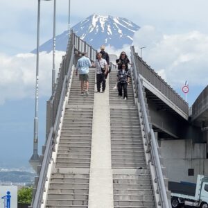 John Daub Instagram - The Fujisan Yumeno Bridge in Fuji City, a 25 min walk from Shin-Fuji Station (Shinkansen) or 7 min bicycle ride, rentals are ¥200 ($1.40) for the day from the tourist office inside the station 🚉 no one there when I arrived at 9am, small groups came by taxi the next 2 hours 😂 a few people walked. Some total divas! Most polite, for a photo and moved on — so, worth the visit? It takes 1 hour 15 min from Tokyo Station to get here. For me, I’d say … #fujisteps #fujicity #mtfuji