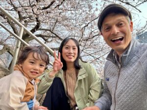 John Daub Instagram - It’s hard not to smile when Tokyo’s looking like this, 100% fully bloomed Cherry Blossoms 🌸 with a 3 year old who loves silly faces, it’s hard to know when he’s really smiling, but today maybe a little easier. The Sakura should be around for a few more days, weather permitting. After the first rain or wind, they usually blow away — and you can catch them again 100km north as they start to bloom up in Tohoku or in the mountains of Nagano. Is the spring better than the fall? I’d say so. Longer days are here again ☀️ and the warmer weather, soon enough.