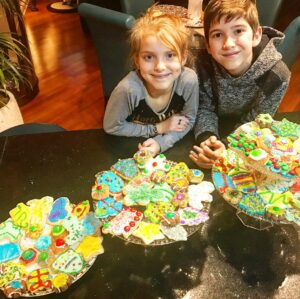 Kadan Rockett Instagram - Not showing our teeth because our mouths are BLUE from eating a few  too many of our creations!  @brooklynrockett @bartrockett #ChristmasCookies #ChristmasTraditions #MerryChristmas #TheMostWonderfulTimeOfTheYear #Christmas2017 #DecoratingCookies #BakingCookies #FamilyTime #MakingMemories #KidMagician #DownTime #FamilyFun