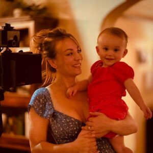 Kaley Cuoco Instagram - When your little lady visits you at work for the first time, it deserves a permanent post ♥️ I dreamed of the classic ‘baby on camera ‘ pic since the day she was born. Maybe she will share this pic in 20 years when she is on the Late Show 😛 📸 Chris Messina