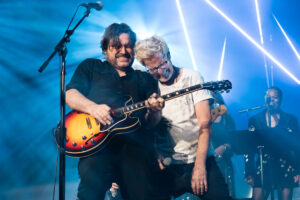 Kevin Cronin Instagram - Hi friends, I am very fortunate that my years with REO Speedwagon have allowed me to be a guest vocalist w/ some amazing “house bands” at various charity events during REO down time. Most recently I joined my friends in the @thejimirsaycollection for another night of good fun & great music at the Shrine Auditorium in LA. 

The mood was a combination of somber & joyful. Somber due to the illness of our leader & benefactor, a man as generous of spirit as with his riches, humble, respectful, and loyal, and a lover of music and everyone involved in creating it, a man I am proud to call a friend, the inimitable Jim Irsay. I wish Jimmy the best as he faces this terribly tough challenge, and I have faith that he will come through it stronger than ever. 

Jim wanted the concert to go on, with or without him, and we all dedicated every note we played and sang to his recovery. I was honored to be among the guest singers that night, all giants in their own right: Ann Wilson of Heart, Peter Wolfe of the J. Geils Band, and Billy Gibbons of ZZ Top. I think you can feel my joy in these photos from my performance, as this amazing band lifted me up and put their masterful imprint on my songs. 

As I write this, the REO boys & I are on a flight from LA to Orlando, for a co-headline show with @styxtheband on Thurs. night. It will be great to see Tommy, JY & the boys, and the great audience our bands attract when we join forces. We will be playing a new & exciting setlist this year, & the band is raring to go. 

The 2024 tour begins on 3/20 in Reading, PA w/ @rickspringfield & lands in Estero, FL w/ @cheaptrick on 4/6. I will be writing about our adventures as our tour winds its way through Charleston, Knoxville, Columbia, Montgomery, St Augustine, & many points in between. You can check reospeedwagon.com for a list of tour dates. We will be announcing a very special summer tour later this month, & are stoked to be sharing the stage w/ an awesome band w/ an amazing lead singer that we have never played with before. So stay tuned! … kc 

Pictured above at the Shrine Auditorium: kc with @kennywayneshepherd, with @bbranch103, and with Tom Vukovich, and doing his “lead singer thing”.