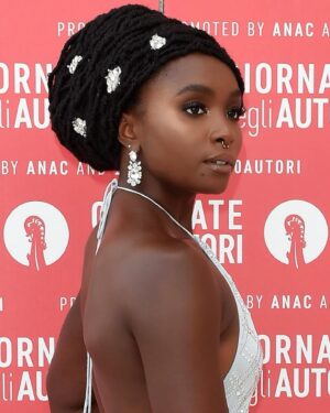 KiKi Layne Instagram - First of all: Bruh, I look like my Mama lol. This is not anything new, but I really see it in this one 😂
Secondly, this is my first appearance as a @fashionfaircosmetics ambassador! Festival days can be really long so it stood out to me how well my skin held up and how natural it looked and felt. I don’t like when I can “feel” the foundation on my face and I don’t have that problem with these products. The lipsticks are available online now on fashionfair.com and sephora.com (I’m wearing one of my favorite shades Ganache in this photo) More products, including foundation and powders, will be available exclusively in @sephora stores on September 9th 😁
#FashionFair
#VeniceFilmFestival #MiuMiuWomensTales #ad