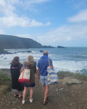 Kirstie Allsopp Instagram - We bought Meadowgate as a ruin just before Oscar was born, 16 years ago, for almost as long we’ve spent every August Bank Holiday here with many friends & their kids. 
This is where many of them had their first taste of independence, walking to the beach alone or going rock pooling and returning safely with their treasures, this year there are only 5 kids with us, and they aren’t really kids at all, the others are working, travelling or studying, living independently as they should be. It is our job to raise our children to leave the nest, the enormous cost of nests aside 🙄. 
I knew that we were becoming a more risk averse culture in the U.K. and the US. My time is Switzerland has taught me a lot there, as in Japan, children walk to school alone and are encouraged to learn early to be self sufficient, and trusted to make sensible choices. I knew that wasn’t happening as much at home and I was interested by the walk of @jonathanhaidt and others who see a link between less freedom & trust and more mental health concerns amongst young people. 
So when I said Oscar had done what so many, many young people did after O Levels, and now after GCSEs, and gone inter railing, despite being Summer born and therefore young for his school year, I knew some people might think 🤔, but I thought his trip was inspiring, and it never occurred to me in a million years that a call from children services would be involved, it’s been a huge shock, not least for Oscar.
But I hope the silver lining to this cloud is that everyone stops & thinks about the freedoms we had as children, and ask what harm could be done, not by the freedoms, but by the restrictions and fears we are imposing on our kids.