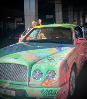 Laurence Llewelyn-Bowen Instagram - For those in search of GLAMOUR WITH A TWIST here’s MrsLLB getting into a spray painted Bentley on our way to Hotel Trois Rois in Basel @grandhotellestroisrois @swisstourism @myswotzerland #IndeedSwitzerland #inlovewithswitzerland