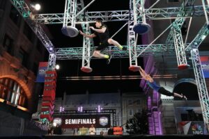 Matt Iseman Instagram - Leaping into a new episode of @ninjawarrior… it’s the SEMIFINALS… head to head racing.  We sell the whole seat but you’ll only need the edge!