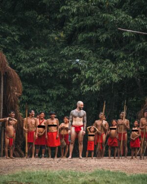 Mike Corey Instagram - Blending in like a fluorescent marshmallow 
Spent 72h with this amazing tribe in the Amazon. 
The Yanomami live on the border between Venezuela and Brazil. 
Their days are spent hunting, fishing, and blowing psychedelic Yopo power in their noses to battle spirits. I tried to go to war with them, it didn’t go so well…. 

Video is now live on YT! Who’s seen it?
Big love to @vidafuria for hosting us in Venezuela!
Photos by @rodrigoungaro