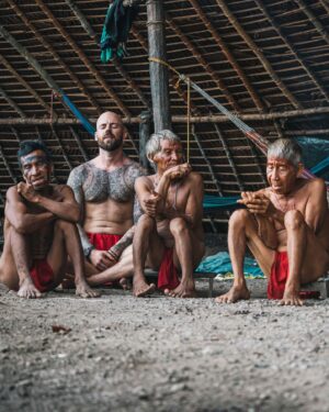 Mike Corey Instagram - Blending in like a fluorescent marshmallow 
Spent 72h with this amazing tribe in the Amazon. 
The Yanomami live on the border between Venezuela and Brazil. 
Their days are spent hunting, fishing, and blowing psychedelic Yopo power in their noses to battle spirits. I tried to go to war with them, it didn’t go so well…. 

Video is now live on YT! Who’s seen it?
Big love to @vidafuria for hosting us in Venezuela!
Photos by @rodrigoungaro