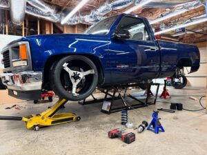Mike Finnegan Instagram - Trying to stuff 275/35R20 @mickeythompsontires Street Comp rubber bands under the front of my 1998 GMC Sierra. Looks like they will go with some minor surgery.  Big enough to show off the @tbmbrakes but with enough sidewall that I won’t have to get my swerve on when I spy ATL potholes.