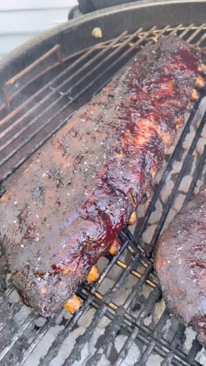 Mike Pecci Instagram - They are ready! Smoked baby back BBQ ribs with Blueberry Sauce! Listen to my podcast. Link in my bio for the recipe!
