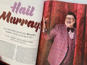 Murray Hill Instagram - TY @bust_magazine for the ink! Loved ya since the 1990s! Had a great chat/interview with @thompsonplaid 📖 This issue is out for the summer! #showbiz #middleaged 
.
.
📷 @lauren_silberman 
🎨 @toddharrismakeup
👓 @caddis_life 
suit: @sharpe.haus 
shirt: @cegonyc 
boss: @mrs_columbo